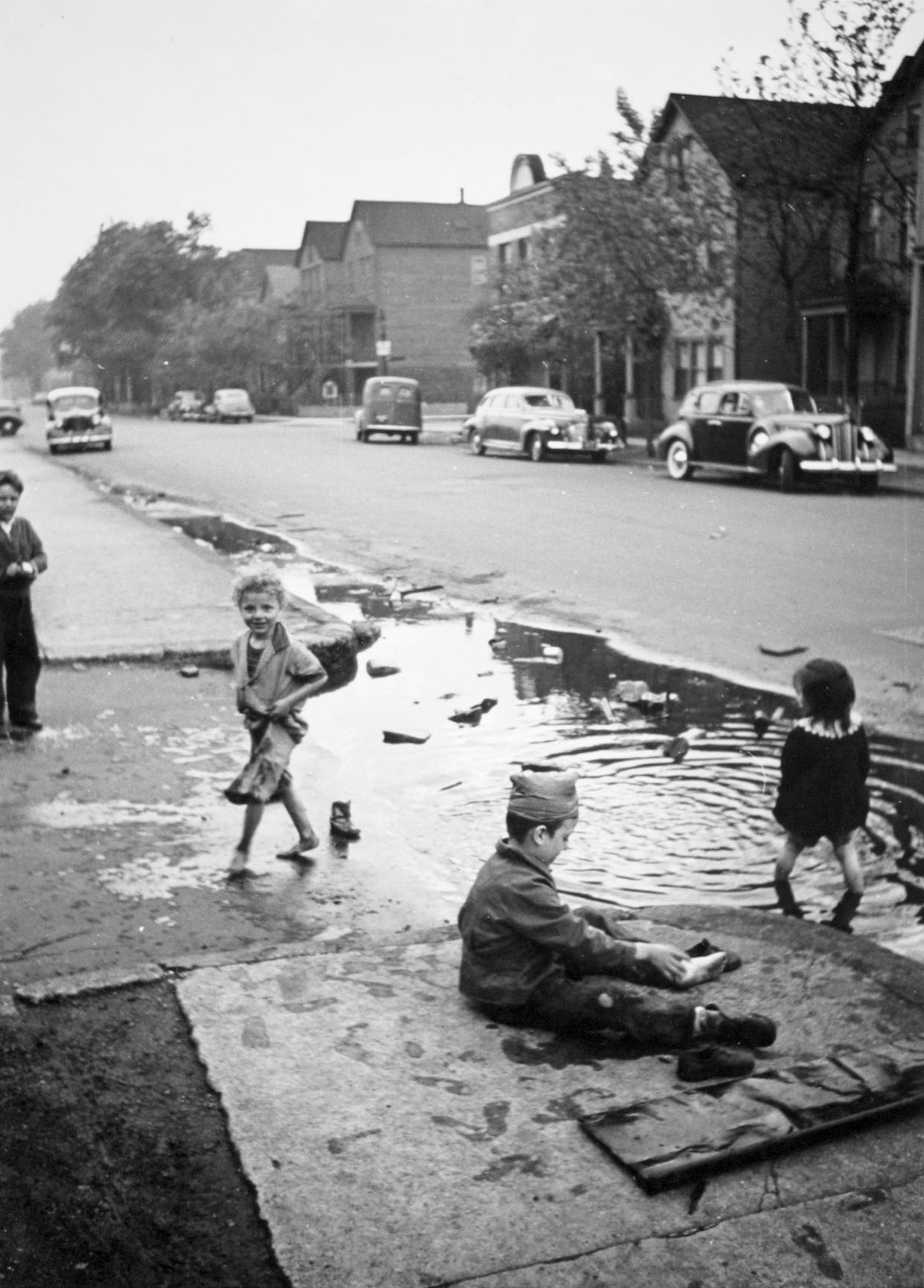 Children Playing in a Puddle