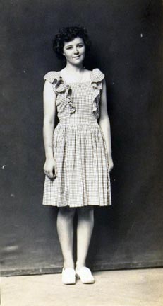 Untitled (woman in checkered pinafore dress)