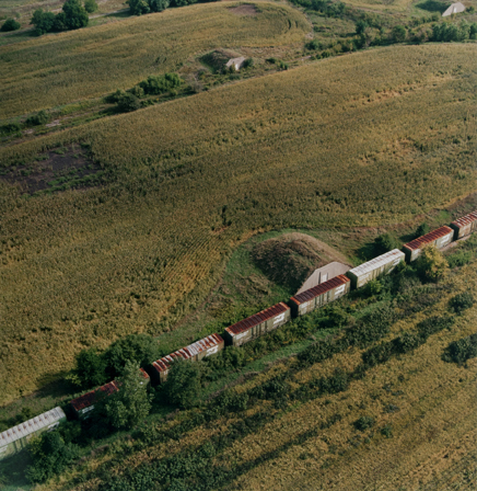 Abandoned bunkers and train, now a cornfield, September 1995.  Former Joliet  Arsenal, Illinois