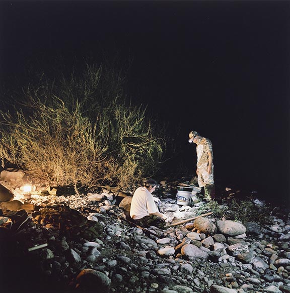 Adolf and Martin night prospecting by the Scott River, Klamath National Forest, California, from the 29 x 29 Portfolio by the graduates of the MFA Photography, Video and Related Media Program at the School of Visual Arts