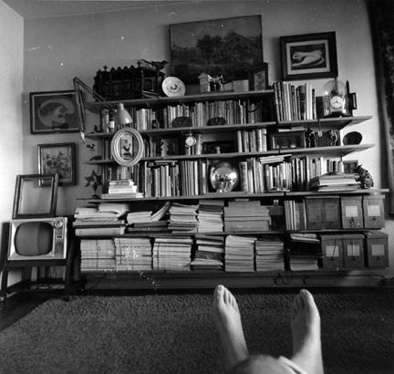 Untitled (Andre's feet in front of study books)