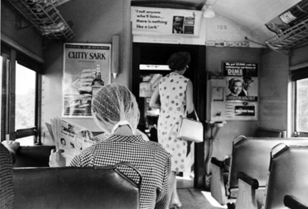L.I. Train (woman reading newspaper)