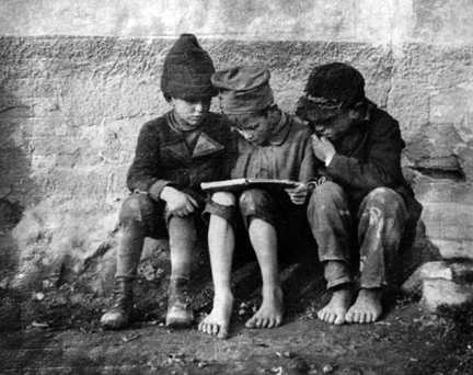 Esztergom, Hungary (three boys reading)