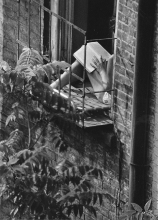 Greenwich Village, New York (woman reading in fire escape window)