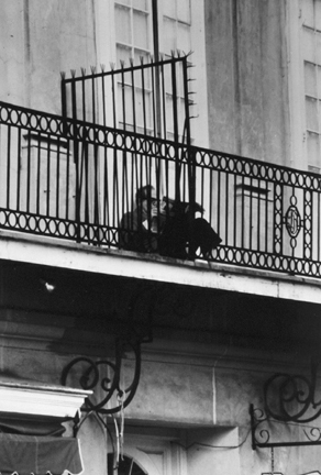 New Orleans, La. (man reading on balcony)