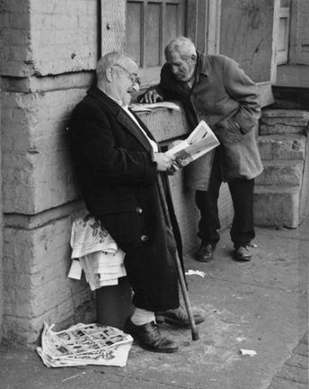 The Bowery, New York (two men reading newspapers)