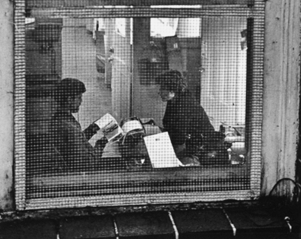 Greenwich Village, New York (people behind screened window)