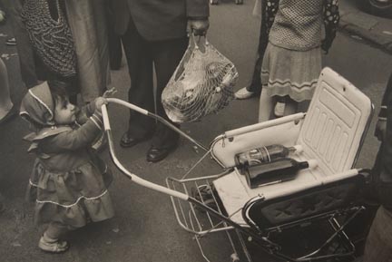 Untitled (Child Holding Buggy, Bottles on Seat), from the 