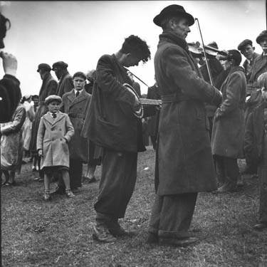 The Dunne brothers of Limerick, one of whom is blind, are well-known for busking at fairs, markets, and in this case a hurling match.