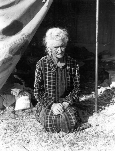 Grandmother of twenty-two children, from a farm in Oklahoma; eighty years old. Now living in camp on the outskirts of Bakersfield, California. 