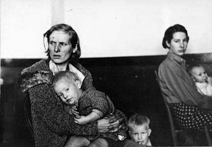 Mother and child, flood refugees in a schoolhouse at Sikeston, Missouri