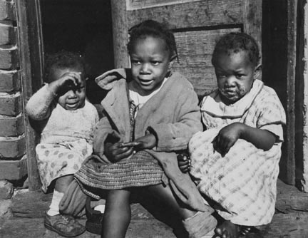 Negro youngsters in doorway of alley dwelling. Washington, D.C.