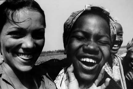 Field (close-up of two girls' faces, laughing)