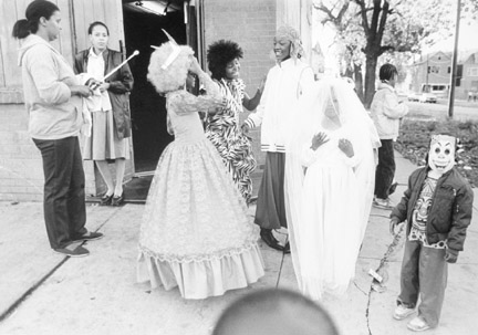 91st Buffalo Avenue. Kids and Their Parents Wait Outside a Community Club House for a Halloween Party, October 31, 1987
