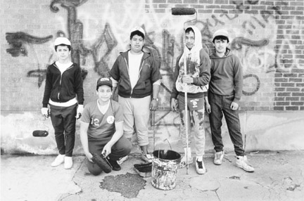 A Group of Young Men Volunteer Their Time to Clean Up the Gang Graffiti From Buildings and Churches, April 16, 1988