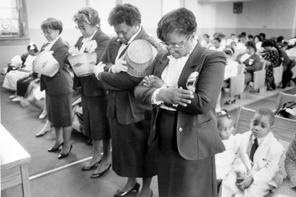 Women Worshippers After Helping in the Collection Bow Their Heads in Prayer, April 3, 1988