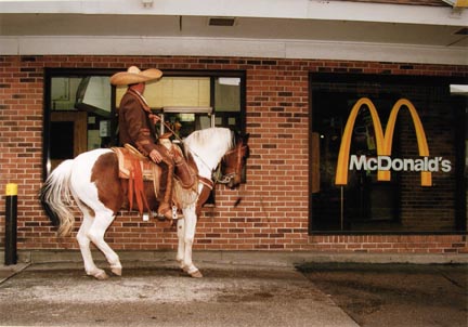 A Man Dressed as Charro on his Horse Waits for his Take-Out Food Before the Start of the Annual Cinco de Mayo Parade Down Cermak in Chicago, September 2000