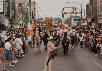 A Young Cowboy Performs Rodeo Rope Tricks as he Marches West on Cermak, During the Annual Cinco de Mayo Parade, May 1996