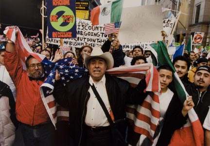 Roberto Cardenas, Center, and Fellow Demonstrators Carry Flags and Signs as they March Along Adams Street in the Loop to Federal Plaza, March 10, 2006