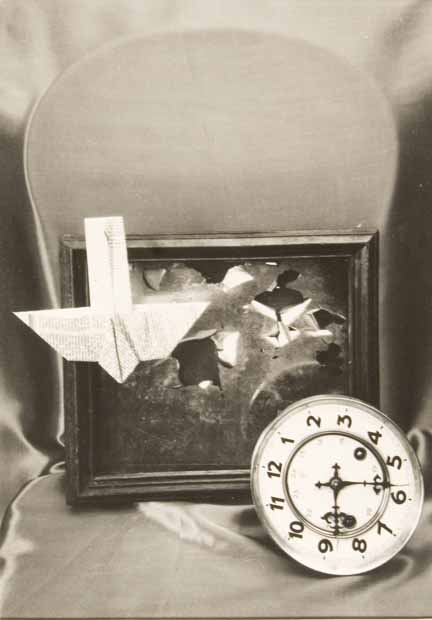 Untitled (clock and paper plane)
