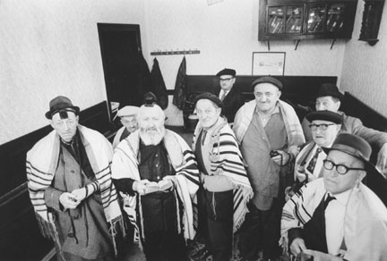 Early morning Minyen - (left to right) Mesrs. Beer, Klugsman, Rabbi Tirnauer, Lehrer, . Ginzer, Samstag, Schonblum, and Samstag senior., from the “The Last Jews of Radauti” series