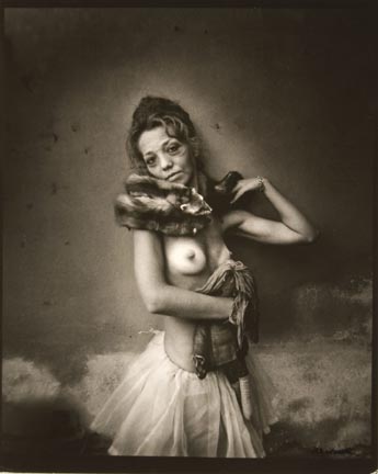 Untitled (woman in tutu and fox collar holding rag doll)