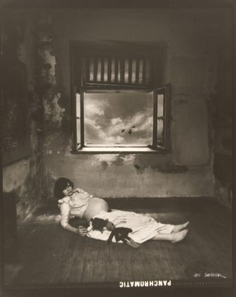 Untitled (pregnant woman lying on floor with doll)