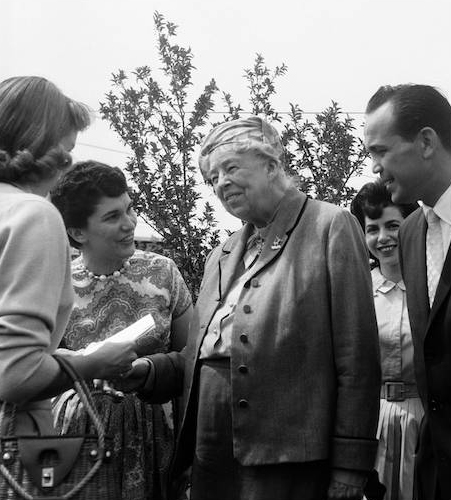 In racially turbulent 1961 Eleanor Roosevelt showed up in Deerfield to help the cause of African-Americans buying two $46,000 homes in a development spawned by an associate of Adlai Stevenson’s law firm. Here, Mrs. FDR visited our fellow activists, the Berliants, and Florence- peeping through at the right, was on the greeting line, as was our 15 year old daughter, Jane. Mrs. Roosevelt’s visit was a great booster for our cause.