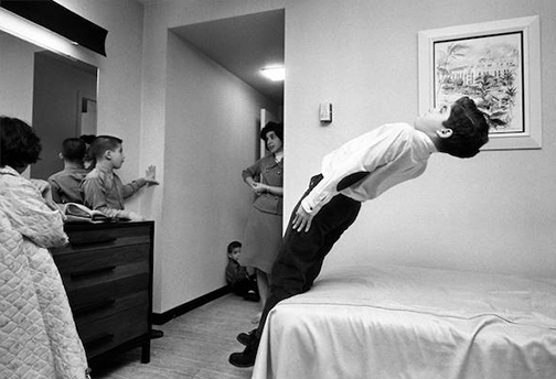 I was doing a magazine story on our suburban family spending a weekend in a downtown hotel during the Christmas season. The kids’ favorite activities? Riding the elevators and calling room service. Here Harmon energetically tests a Sheraton mattress as we settle in.