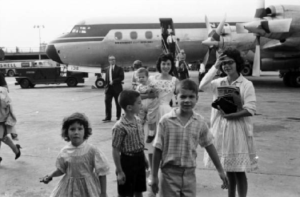 For long distance travel we preferred the airplane. Here, early in the Sixties we arrived at LaGuardia Field, to visit the kids’ Brooklyn grandparents. Note the slow  propeller plane.