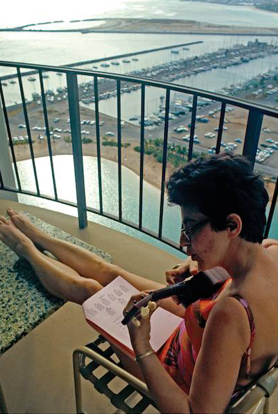 From our Hawaii balcony in 1970, Florence makes a determined effort to play the ukulele. She said, “After learning to spell ukulele, the rest is easy.”