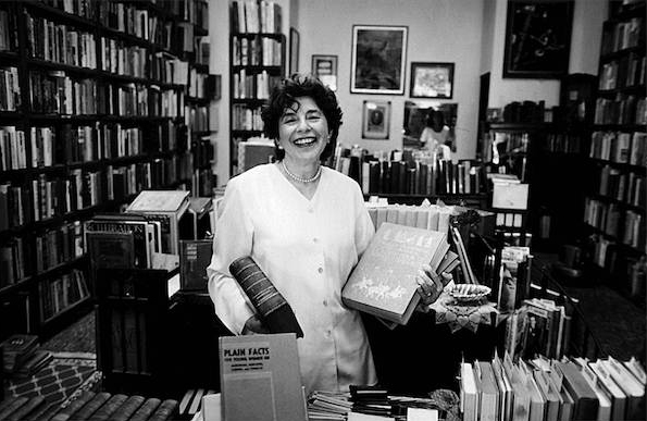 Florence poses filling a rare book order for a foreign customer in her shop.  My favorite Florence story involving foreign sales: Florence had bought a fine Gold Coast collection of unusual and expensive books. On the same day she sold separate books on falconry to an Arab prince and a Japanese dealer with a Samurai customer.