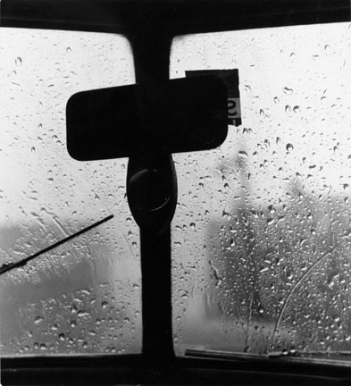 Untitled (Rearview mirror, wiper, rain covered windsheild)