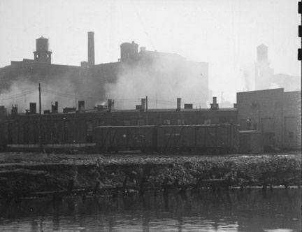 Untitled (Two railroad cars and factory buildings)